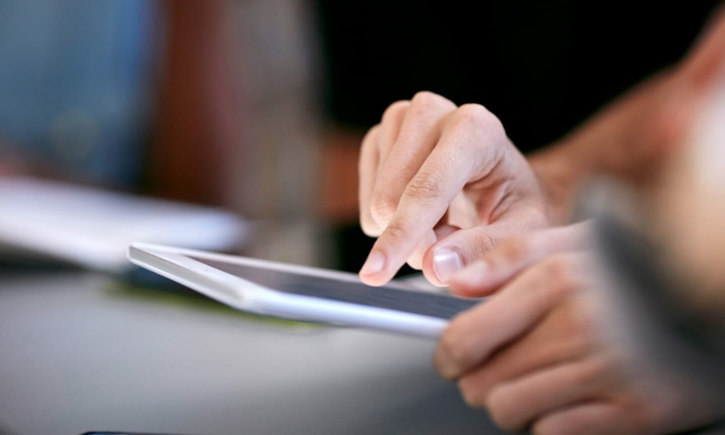 Close up of hand using a touch screen