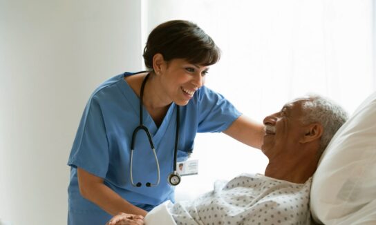Nurse with elderly male patient