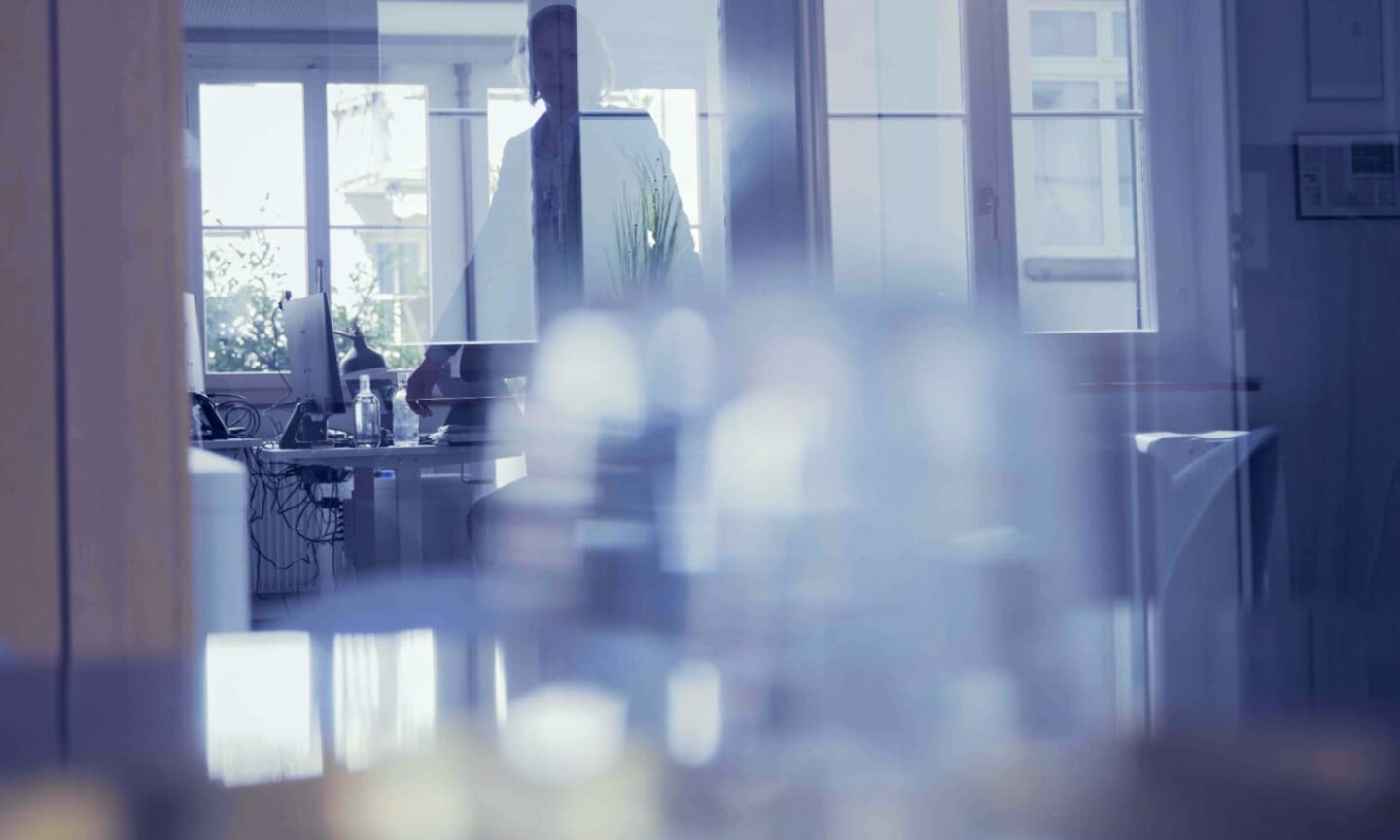 Photography of office interior with business woman in background