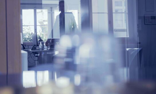 Photography of office interior with business woman in background