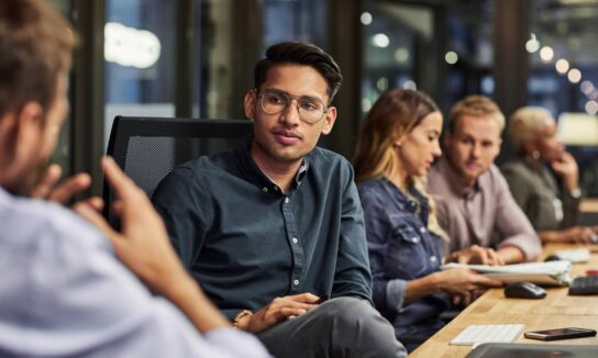 group-of-office-workers-around-a-meeting-table